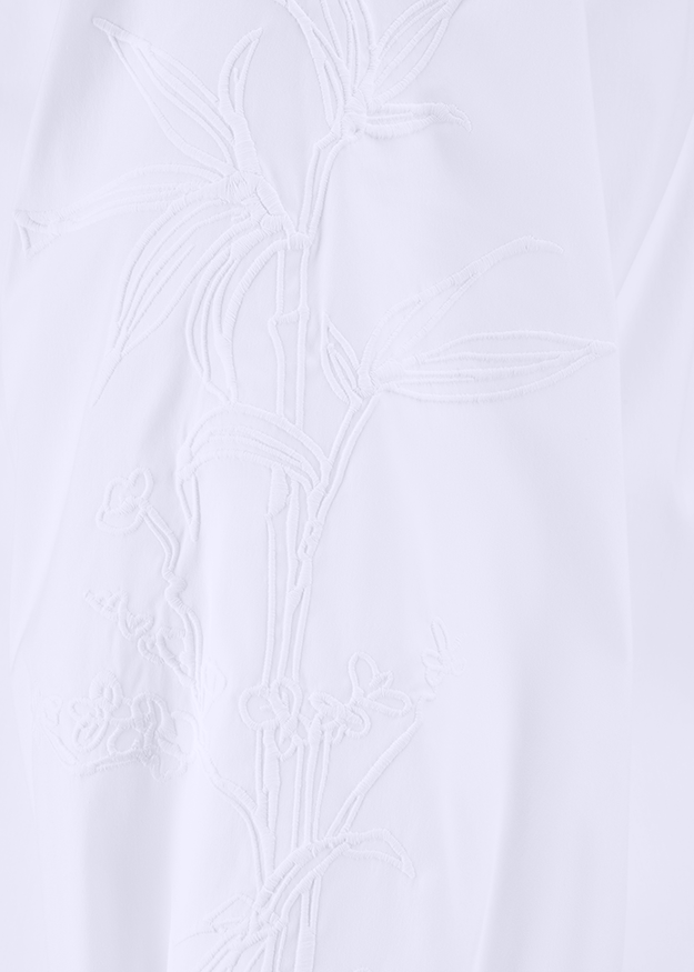  embroidery,  floral pattern,  white fabric,  sleeve detail,  lightweight fabric